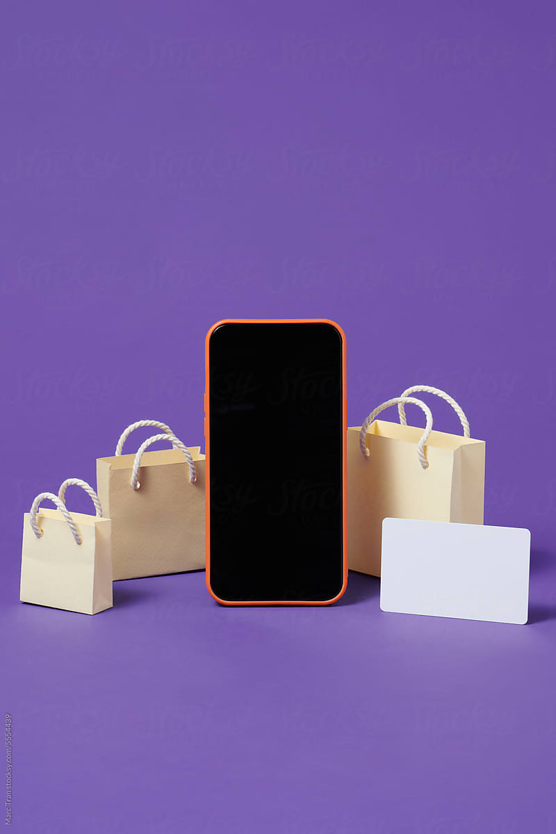 Smartphone with shopping bags. online shopping concept