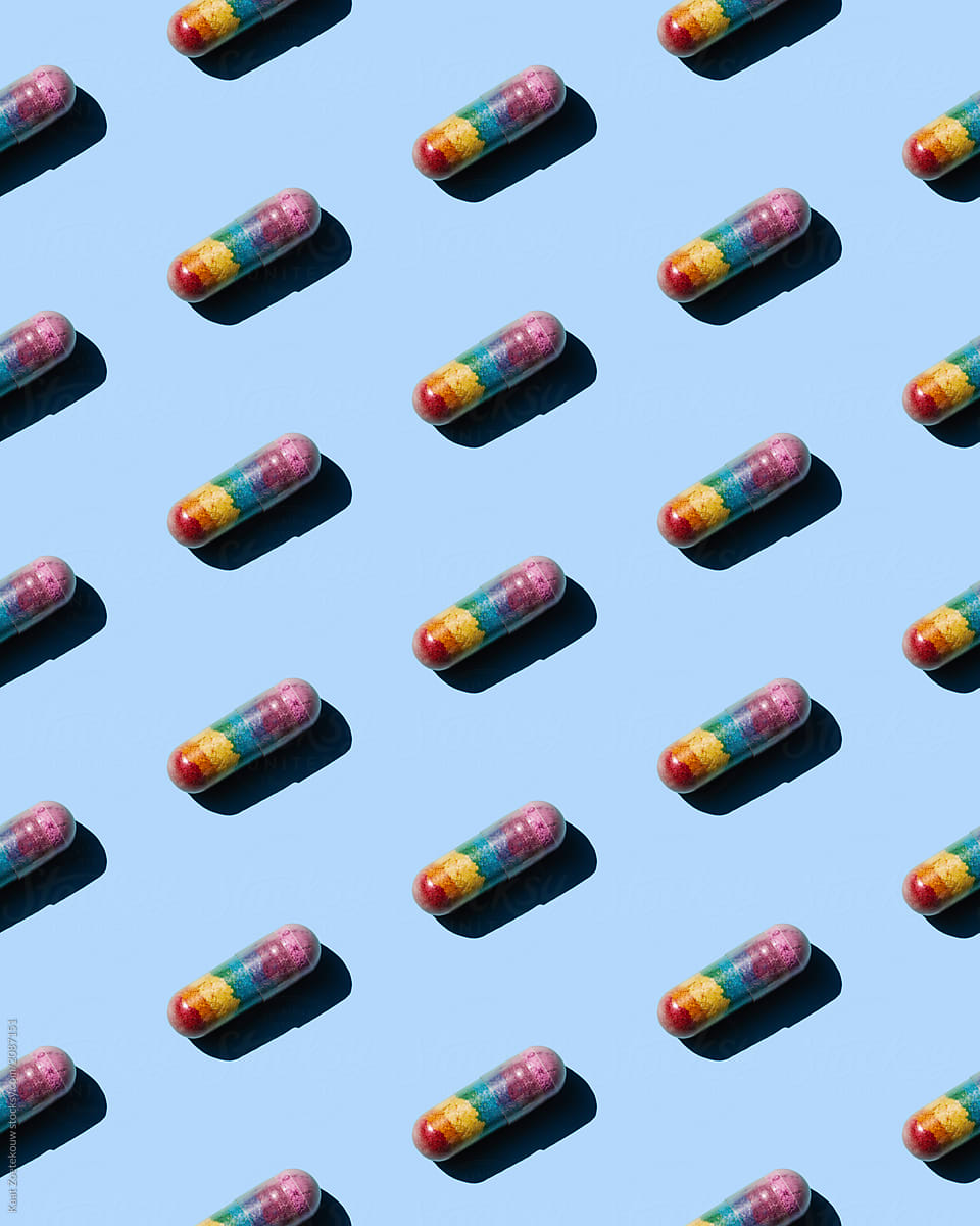 Pills that make people feel better, patterned on a baby blue background