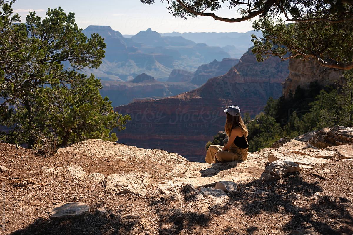 A tourist enjoys a sunny day at Colorado Canyon