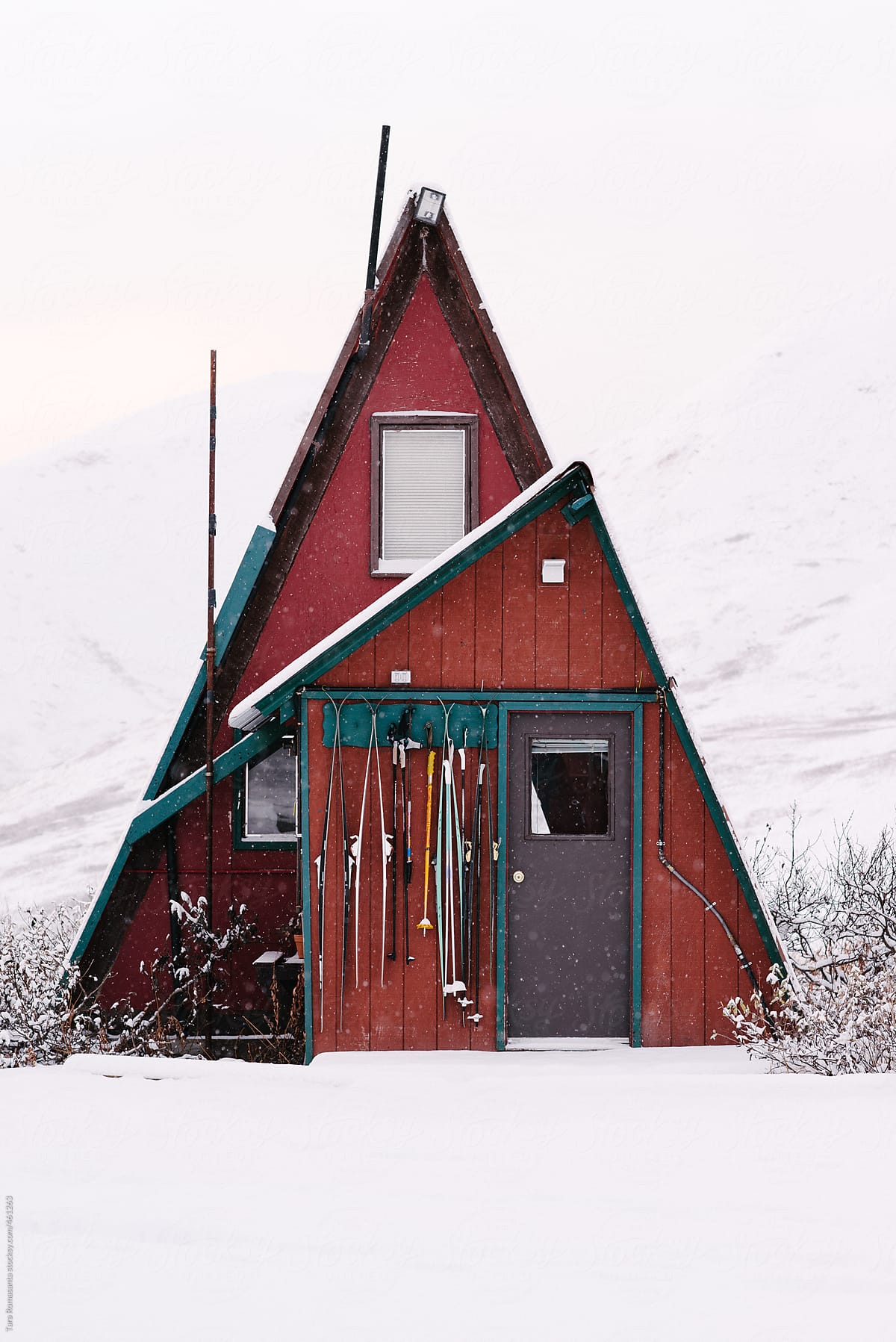 A-frame cabin in Alaska in the snow