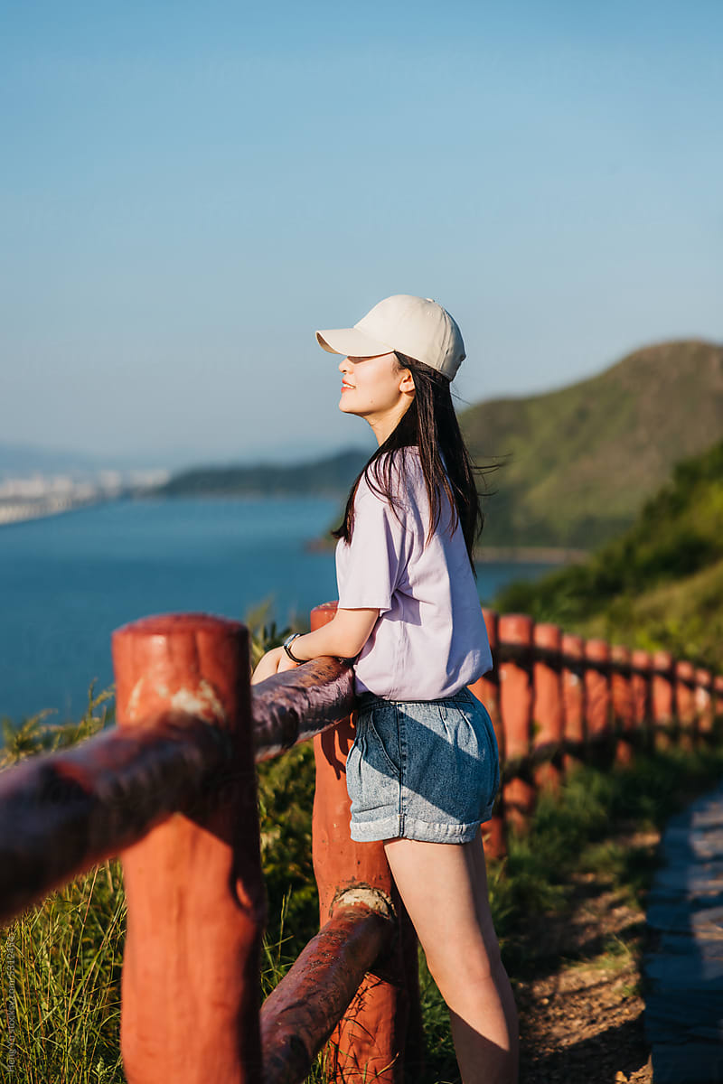 Asian Young Woman Hiking Outdoor by Stocksy Contributor Heng Yu
