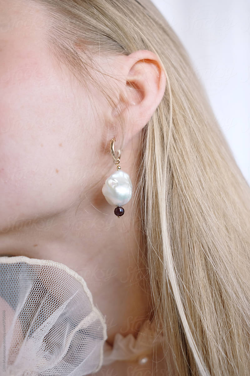Woman Ear And Earring Detail