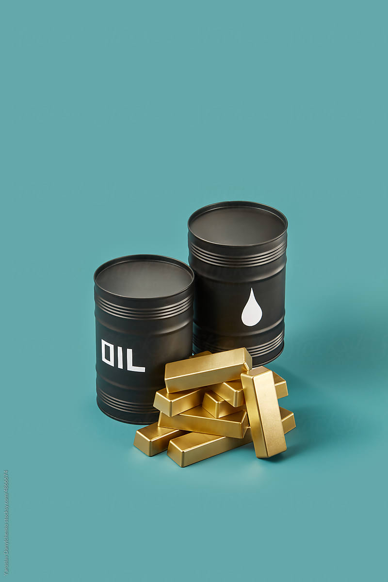 Crude oil barrels and golden bars.