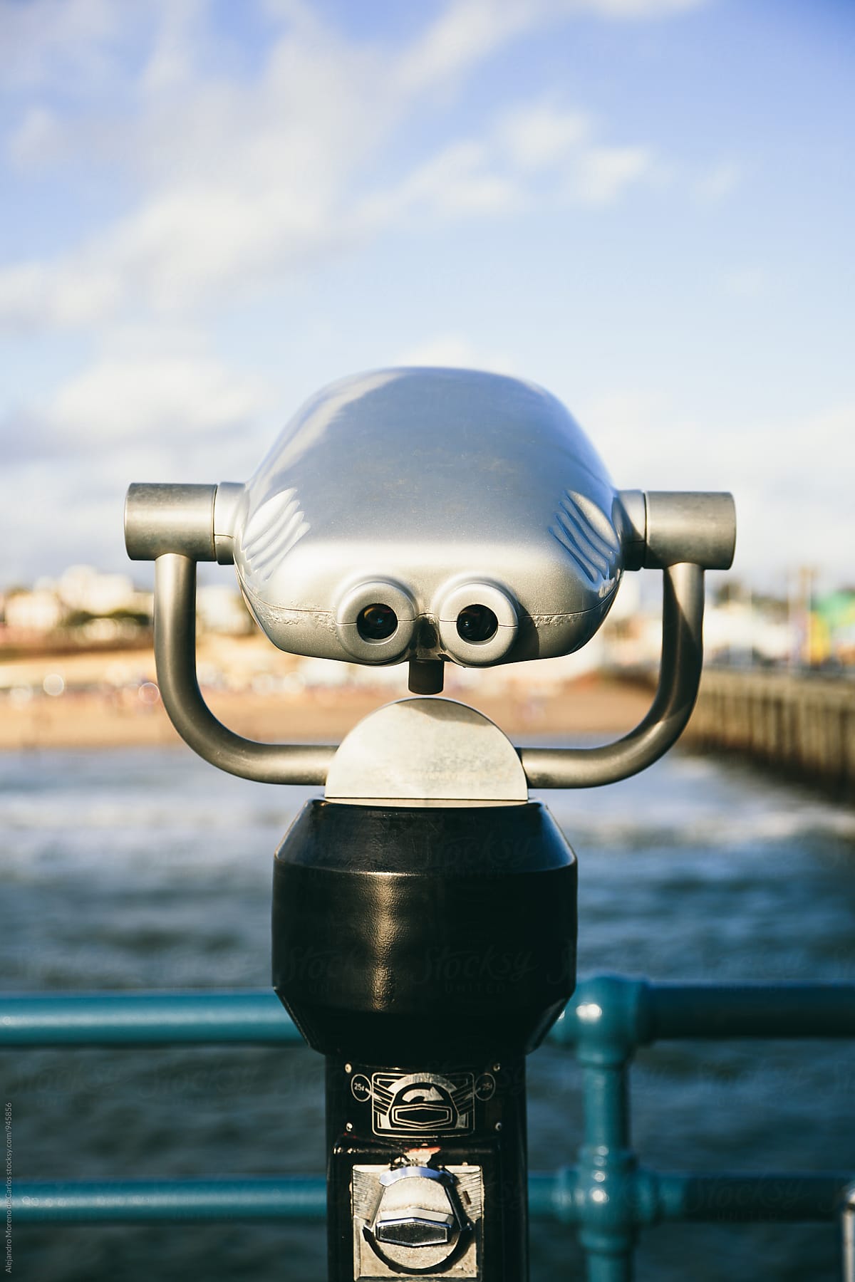 Binoculars on sunny pier