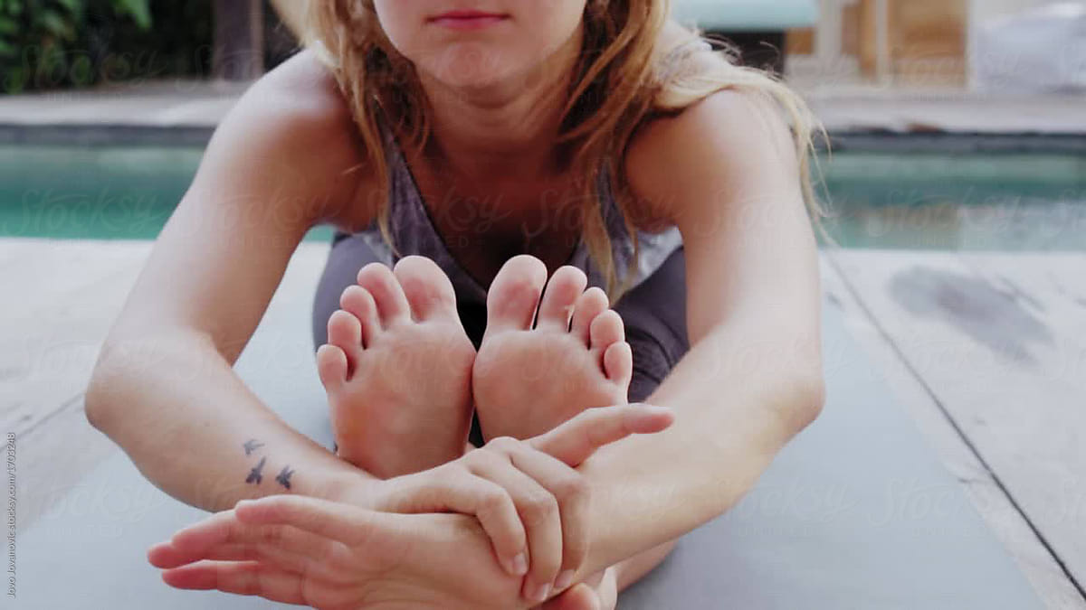 Woman Exercising With Yoga Barefoot By Stocksy Contributor Jovo 6734