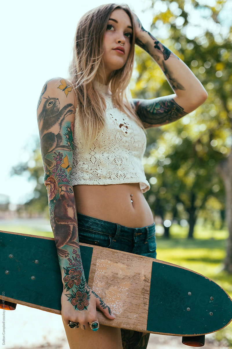 Young Tattooed Girl Skate Boarding Around Town By Dalton -1612