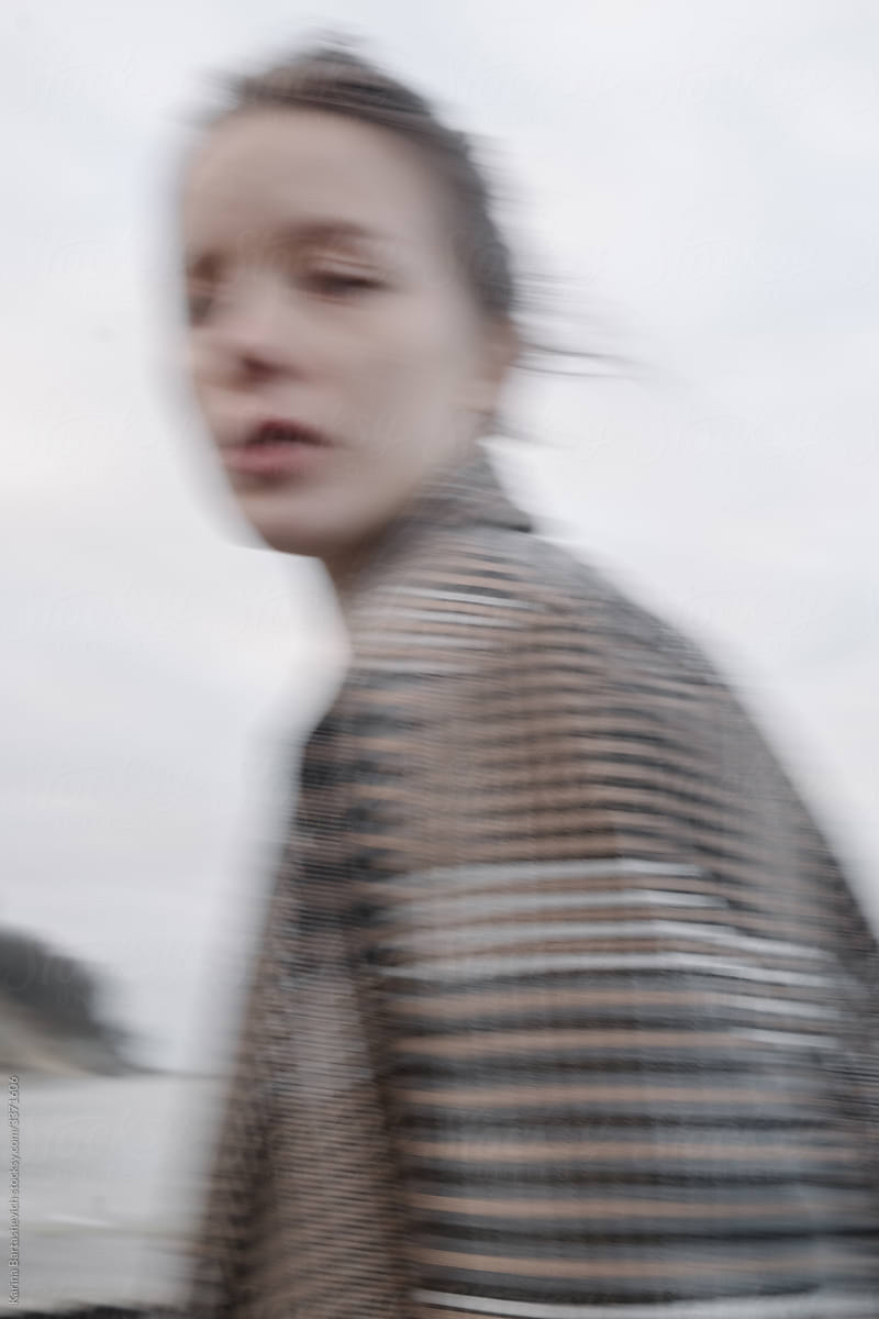 Blurred portrait of a girl near the sea