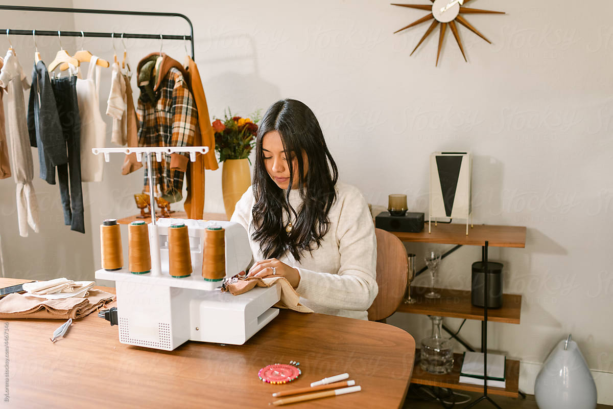 Designer business owner sewing in her studio