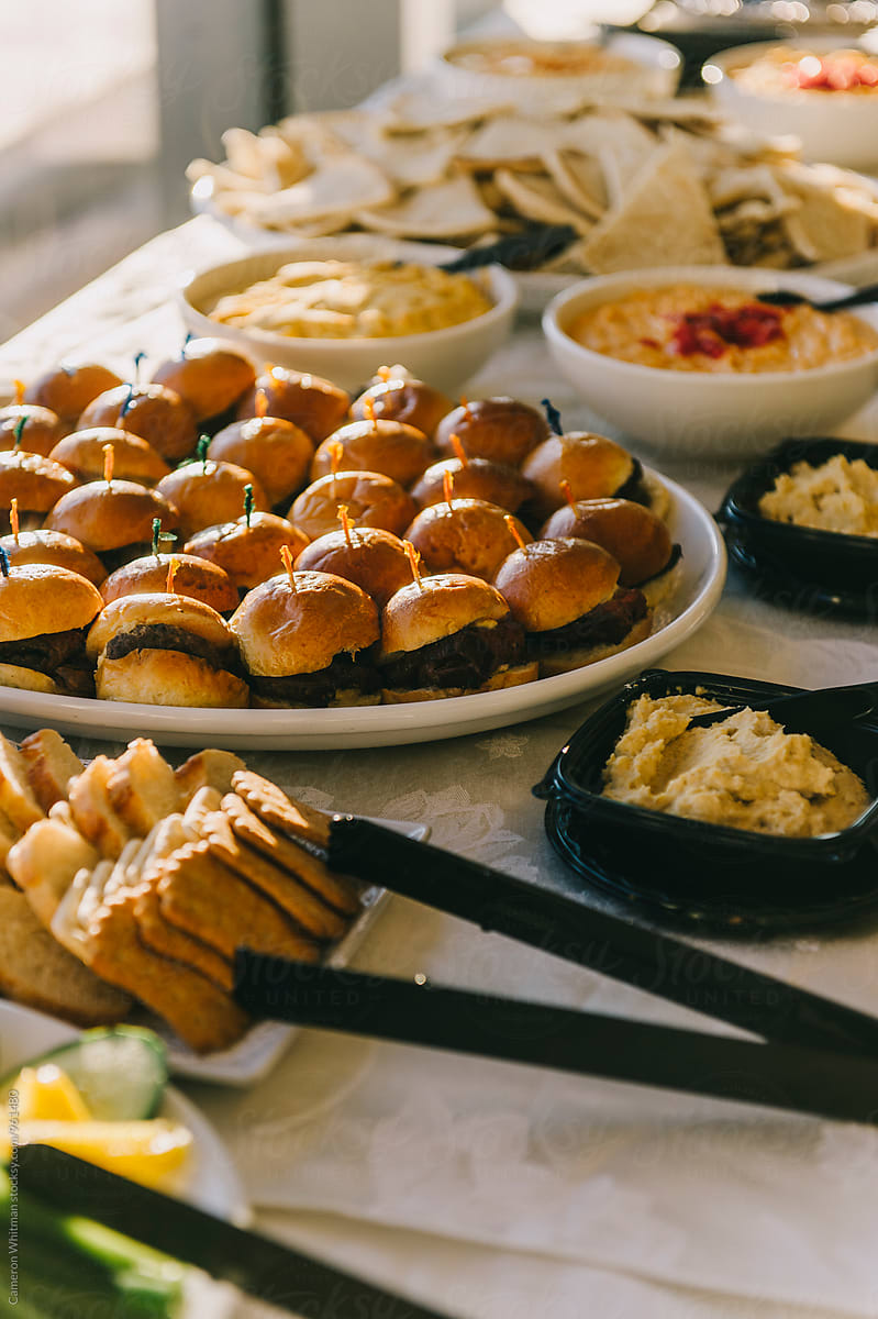 Party table with assortment of finger foods and appetizers