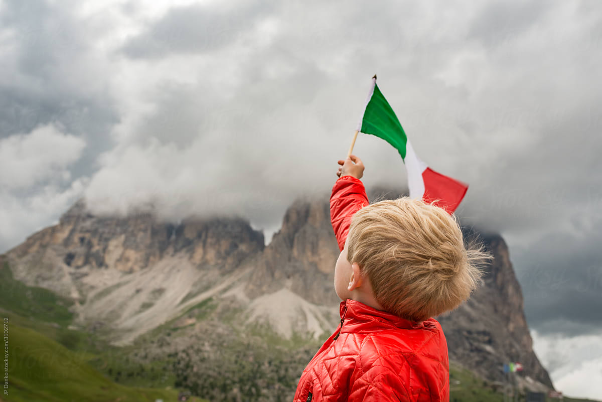 Boy Waving Italian Flag at Passo Sella Northern Italy Dolomite Mountains Italian Alps