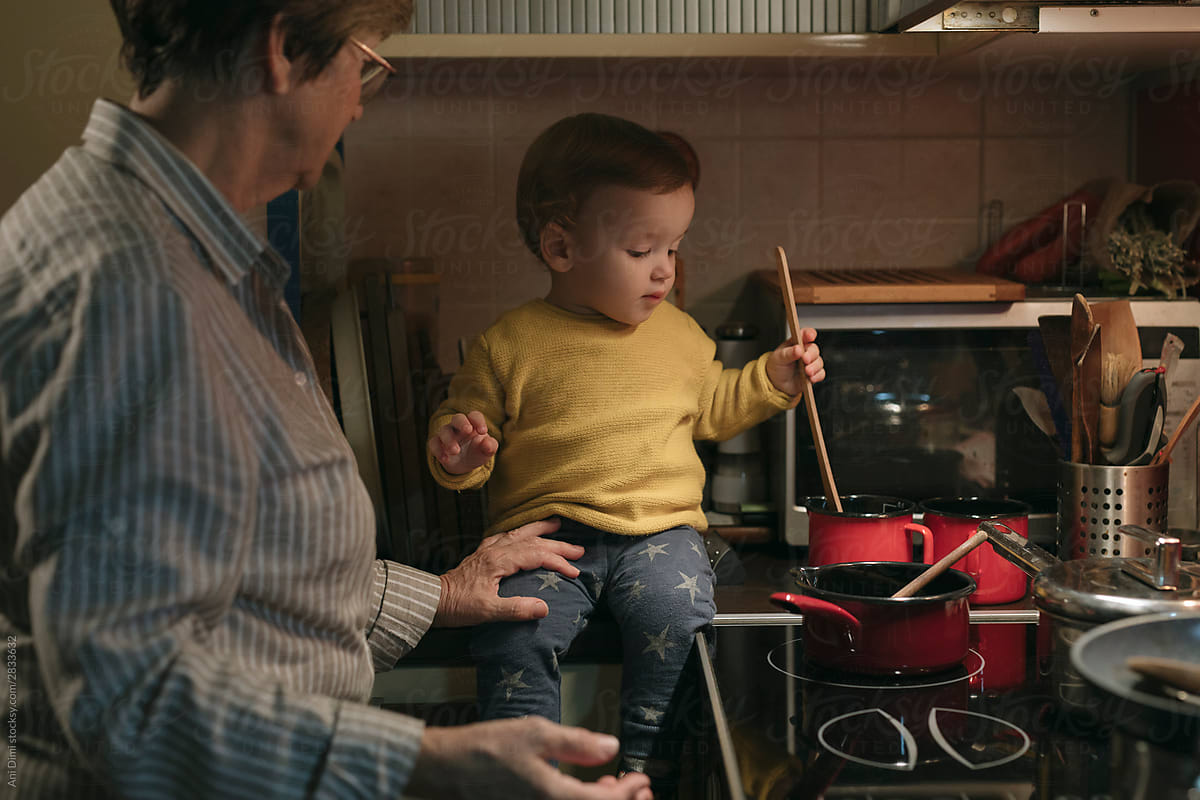 Toddler Enjoying Time With Grandma cooking