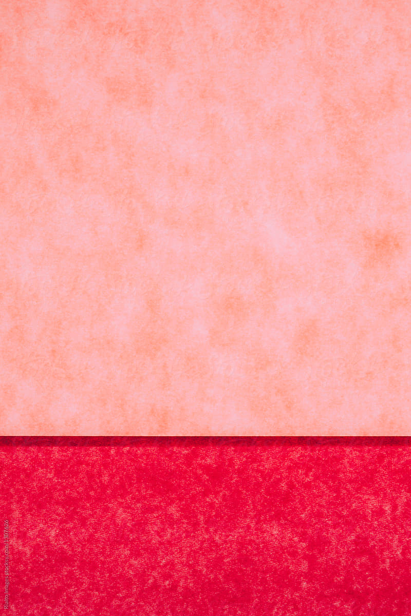 Detail of red and pink sheets of construction paper