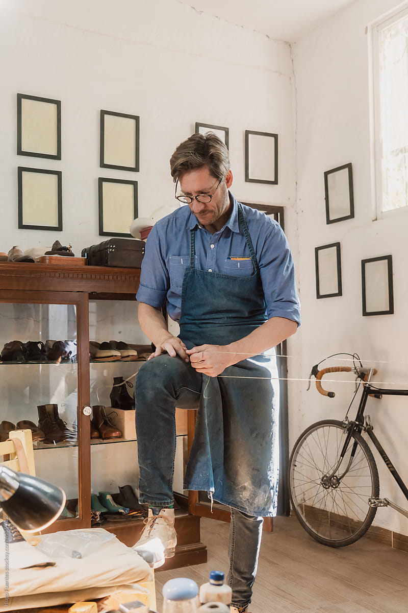 Artisan Shoemaker in vintage workshop