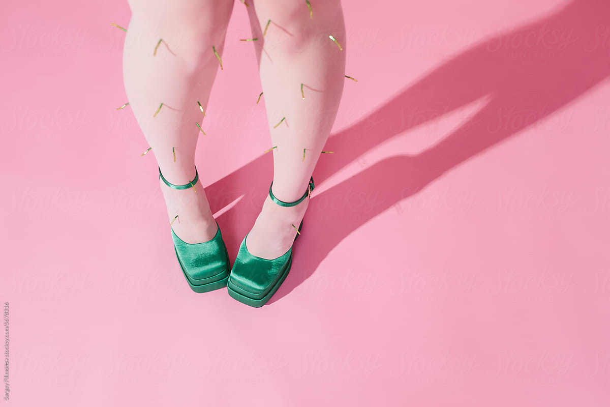 Woman Legs In Colorful Shoes On Pink Background