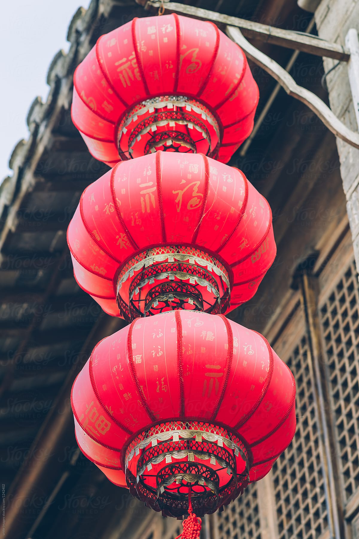 Red chinese lanterns hanging outside houses