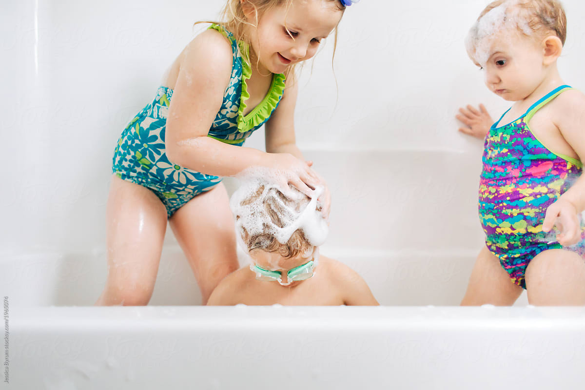 Toddler Enjoying A Bubble Bath At Home by Stocksy Contributor