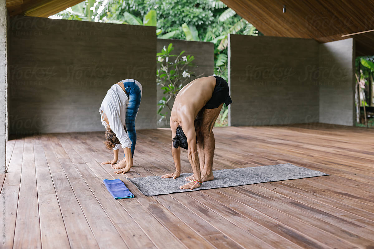 Two people doing yoga together