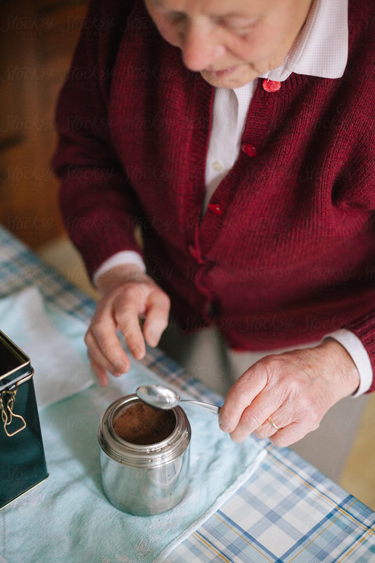 senior-woman-making-coffee-with-an-italian-moka-by-stocksy