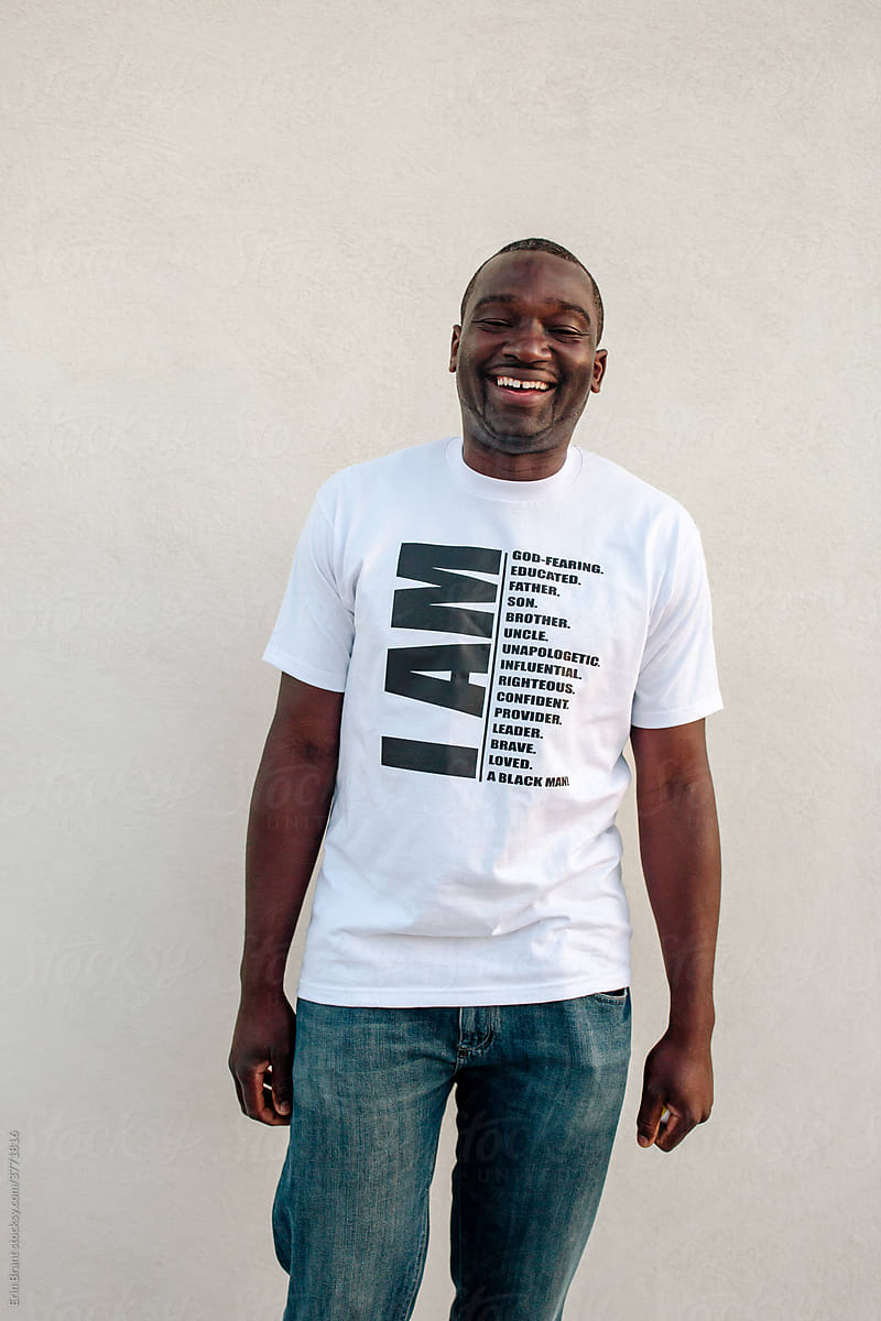 Smiling Black man wearing t-shirt