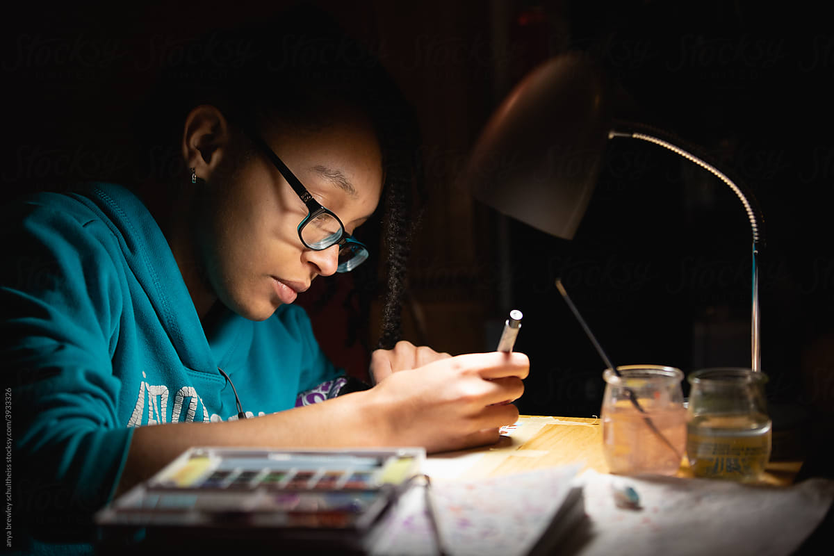 Teenager Working On Art For School By Lamplight by Stocksy Contributor  Anya Brewley Schultheiss - Stocksy