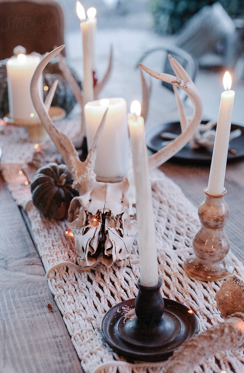 deer skull and candles on Halloween tableq