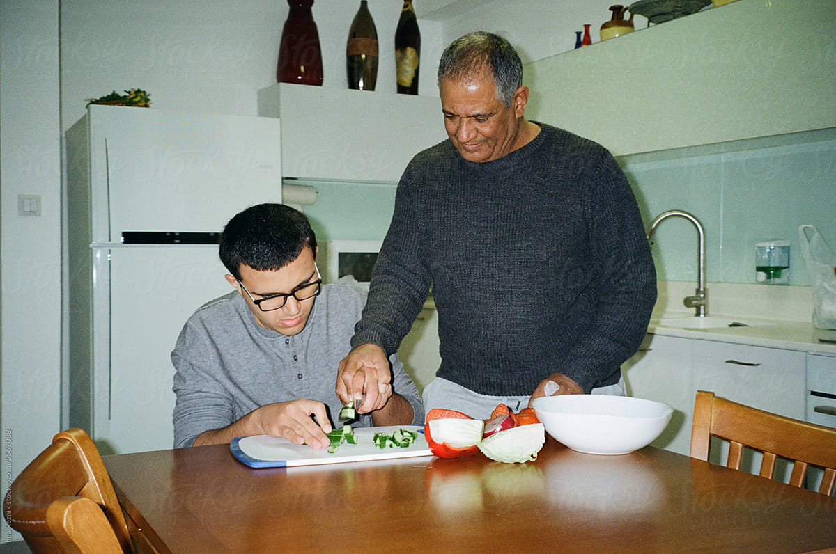 Empowering Independence,Father and Boy Cutting Vegetables.