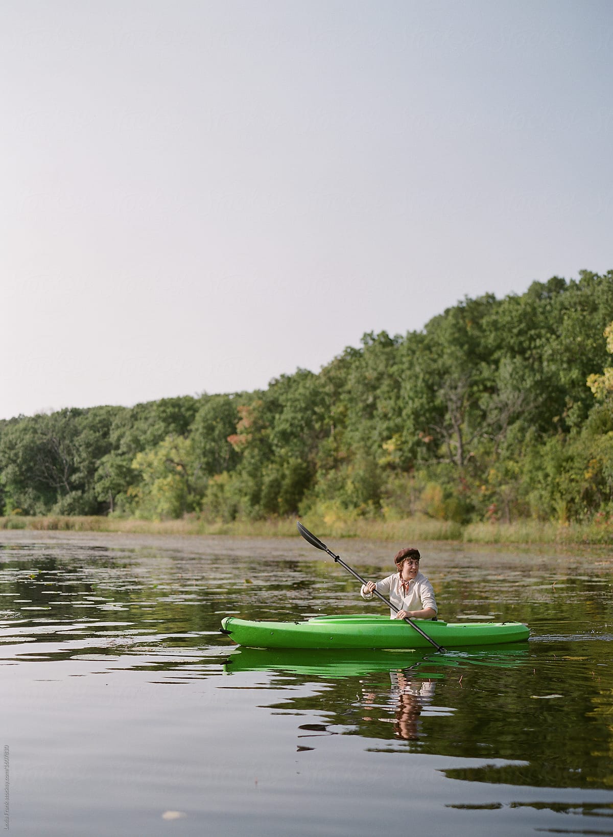 woman kayaking on lake