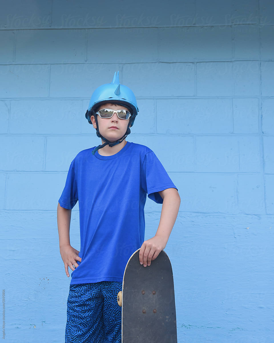 Cool Boy Holding Skateboard