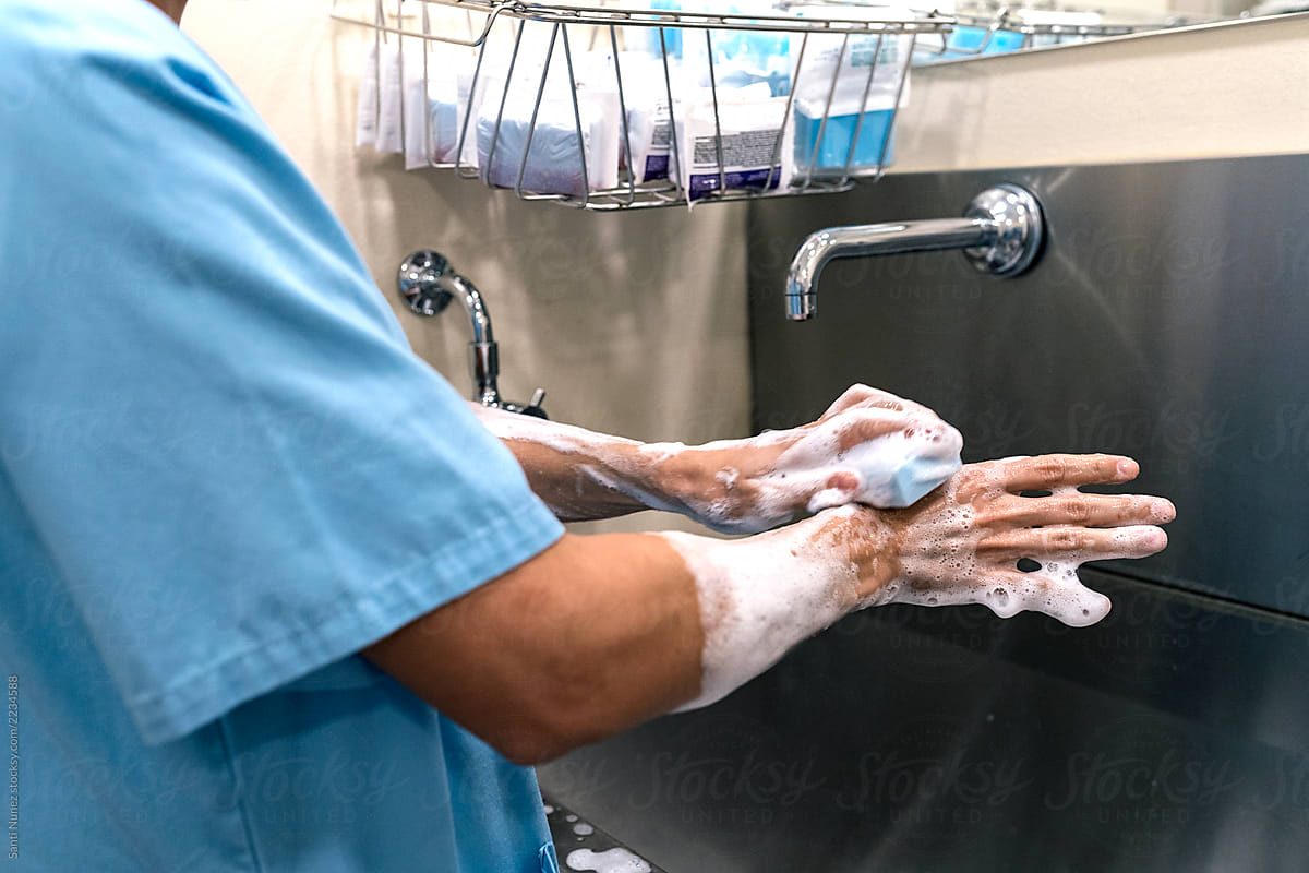 Unrecognizable doctor Washing Hands Before Operating