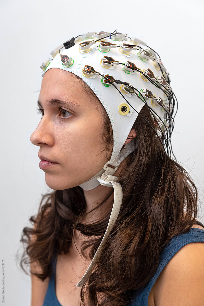 Woman in EEG cap before a procedure