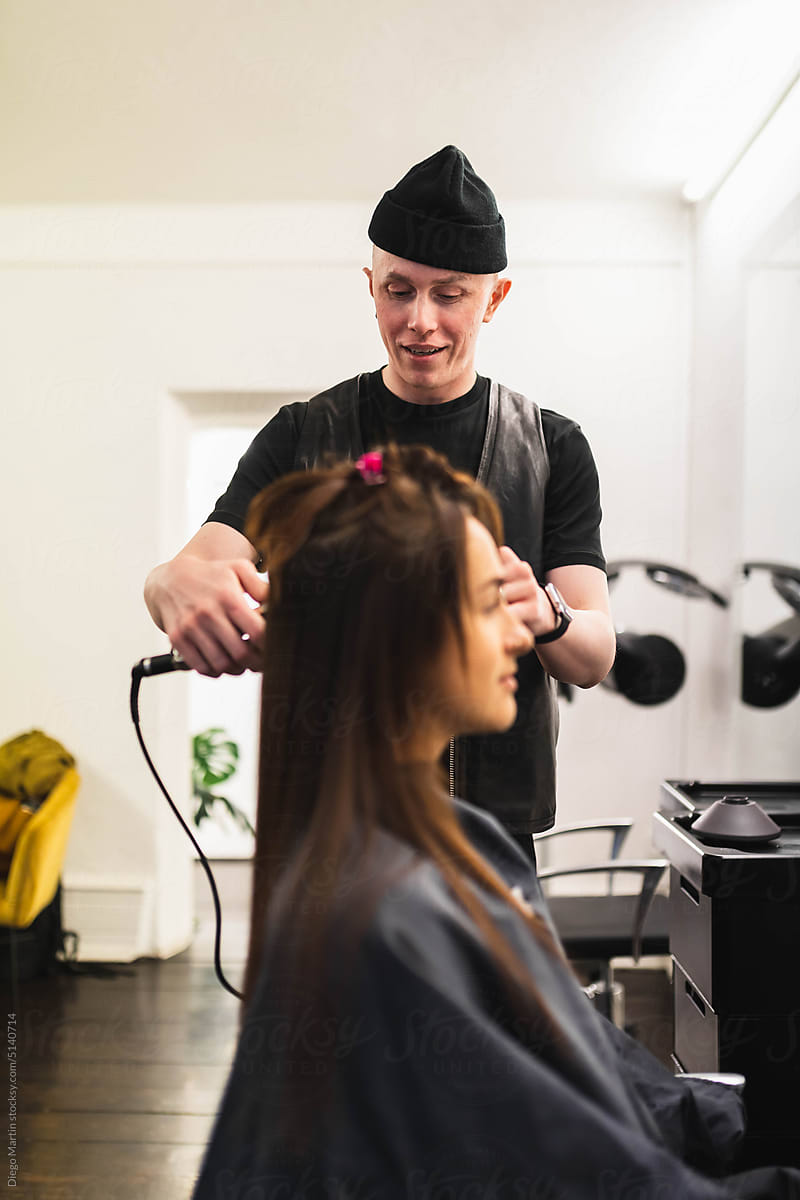Hairdresser working on woman\'s hair