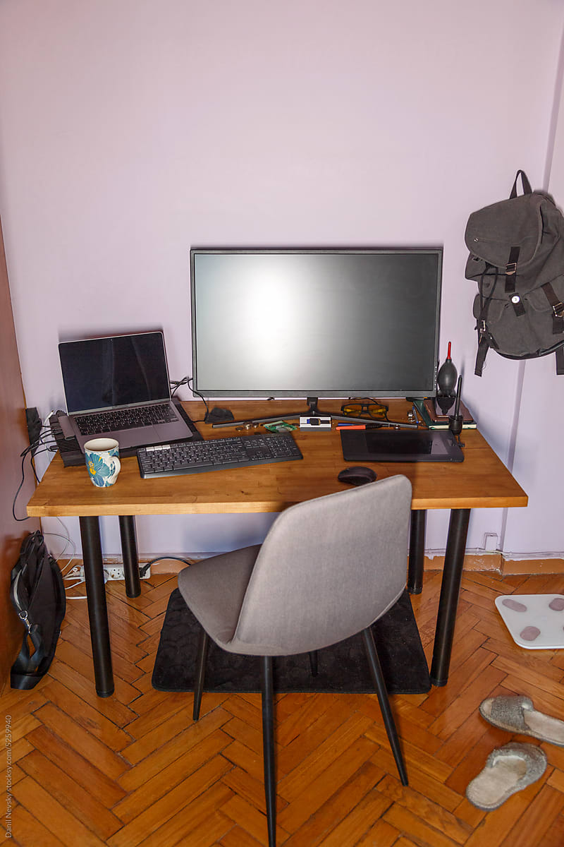 Modern computer on table against chair