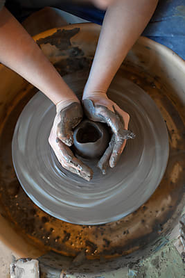 Shaping A Clay On Electric Pottery Wheel by Stocksy Contributor Jelena  Jojic Tomic - Stocksy