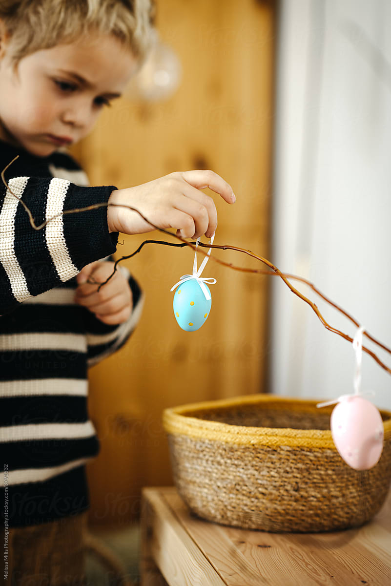 Toddler with painted egg for Easter