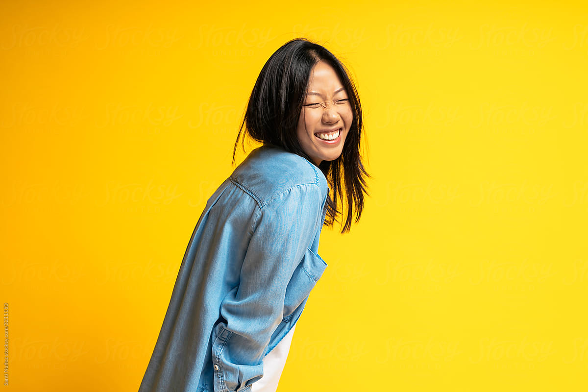 Portrait of Young Asian Woman Laughing