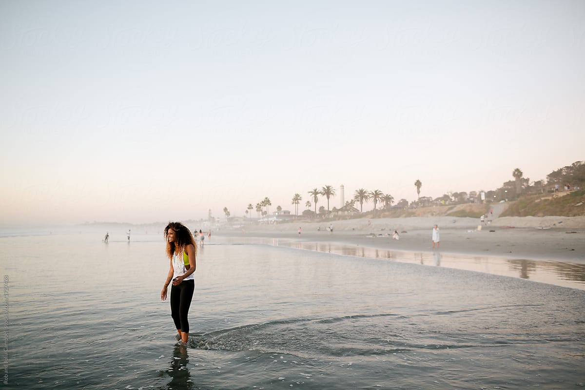 Fit Stylish Woman Enjoying Sunset Walk In Ocean Water By Stocksy Contributor Rob And Julia