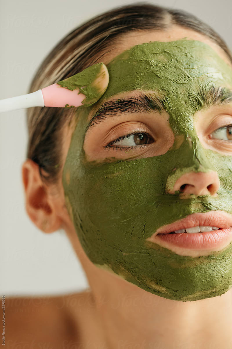 Woman with Green Facial Mask