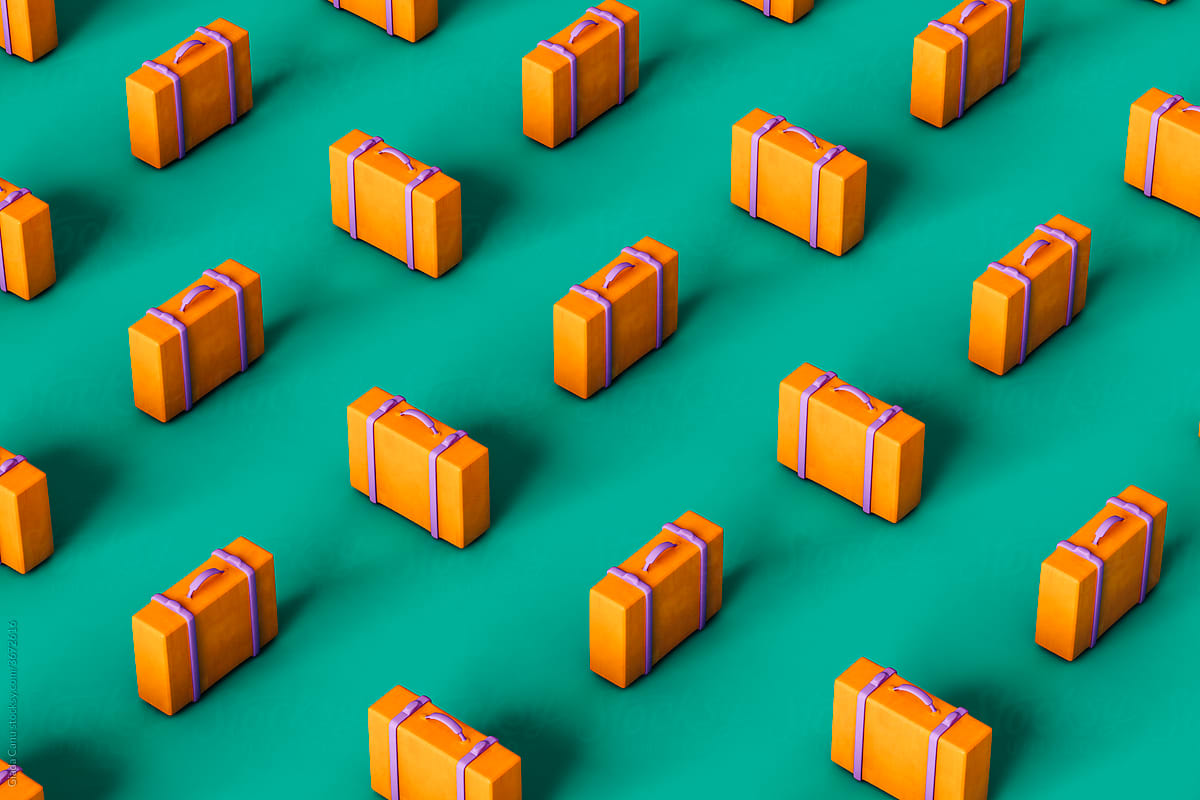 orange suitcases on green background