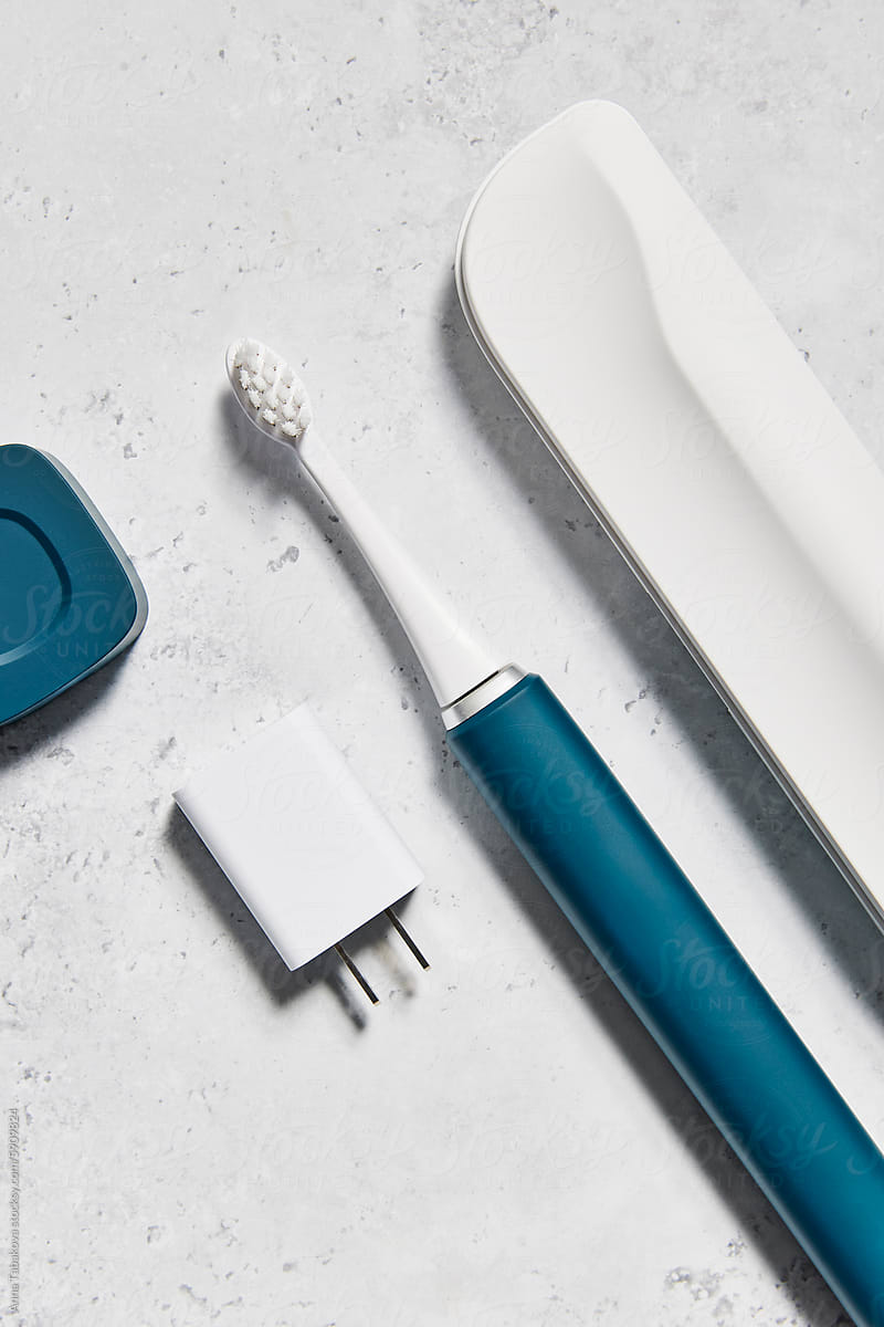 Blue electric toothbrush with accessories