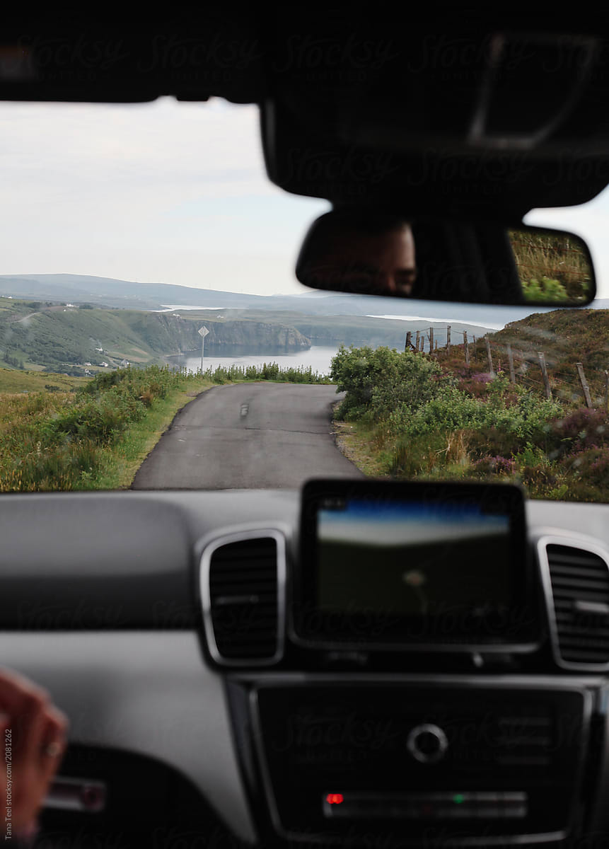 driving on rural one lane road in remote area of Scotland