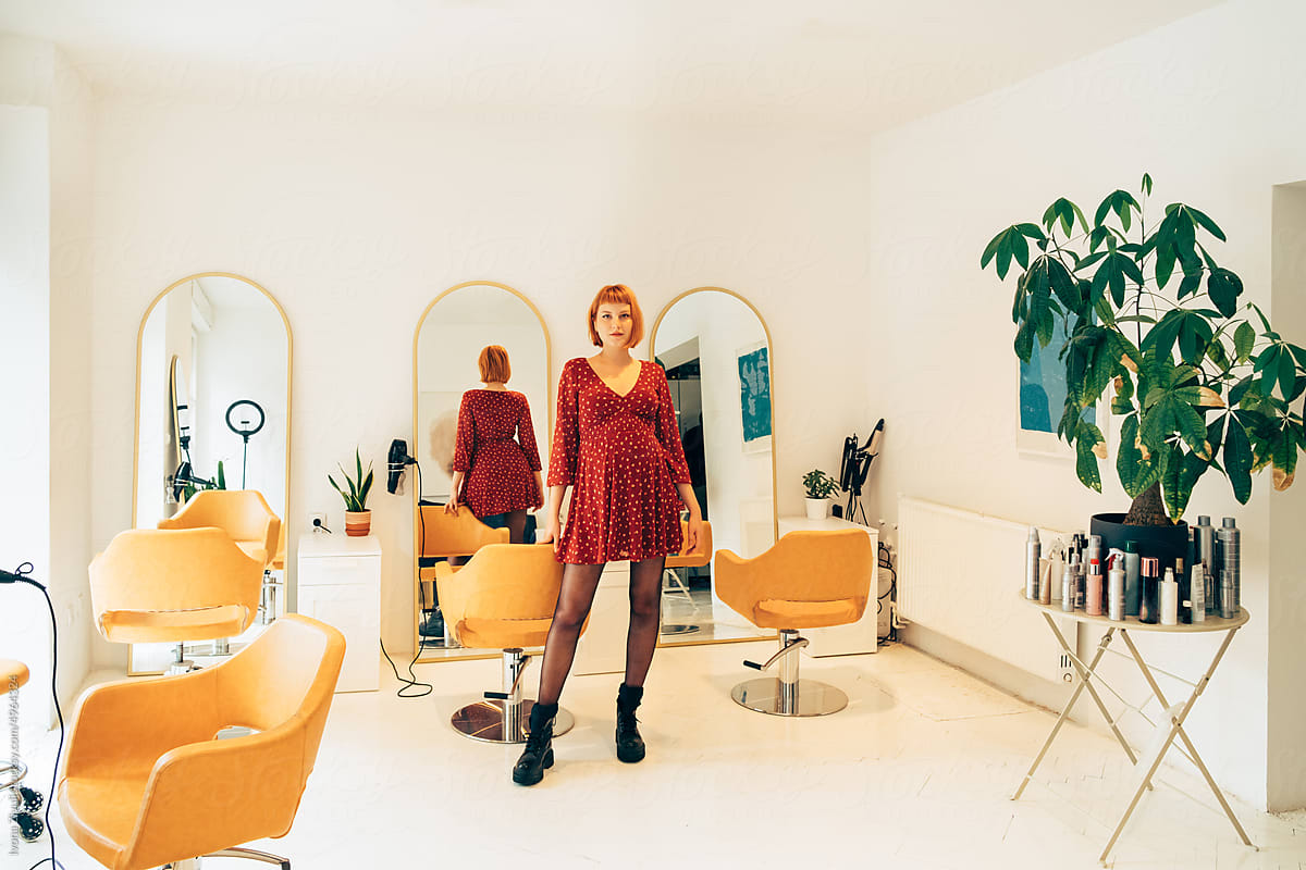 Portrait of Pretty Pregnant Hairdresser in Her Salon