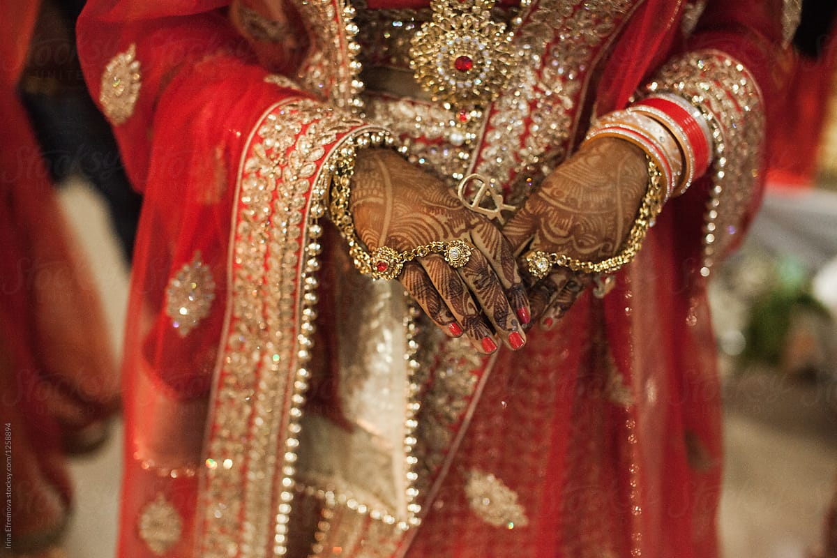 Detail shot of hands at an Indian wedding ceremony