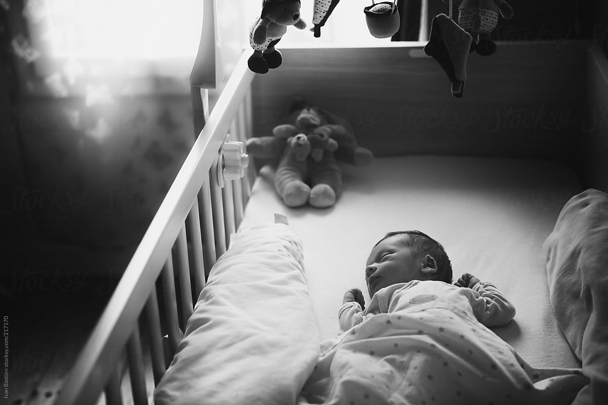One Week Old Baby Boy Sleeping In His Bed By Stocksy Contributor One Week Old Baby Boy Sleeping In His Bed By Stocksy Contributor