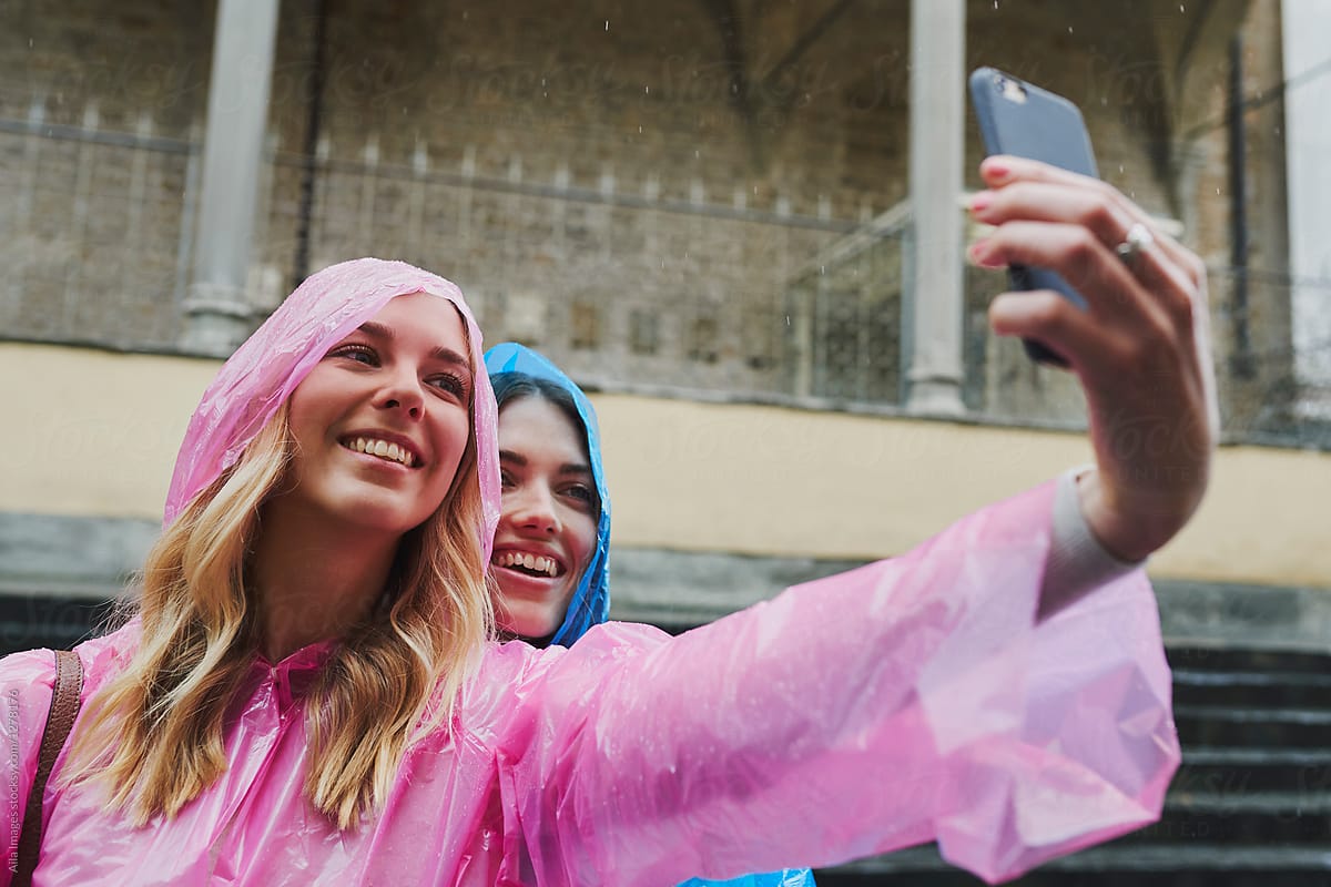 Beautiful girl friends travel taking selfies camera photo in rai
