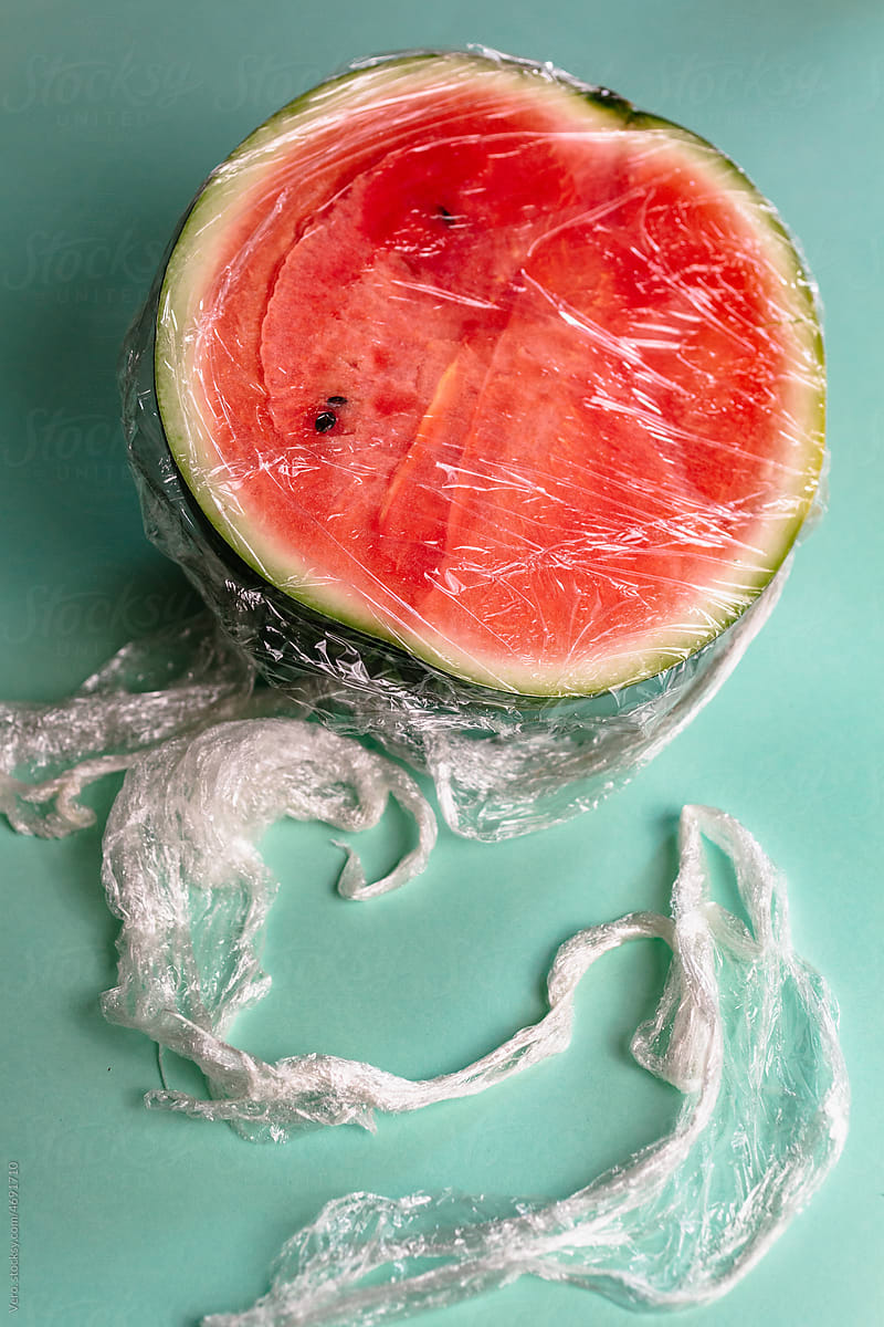 A watermelon covered by plastic