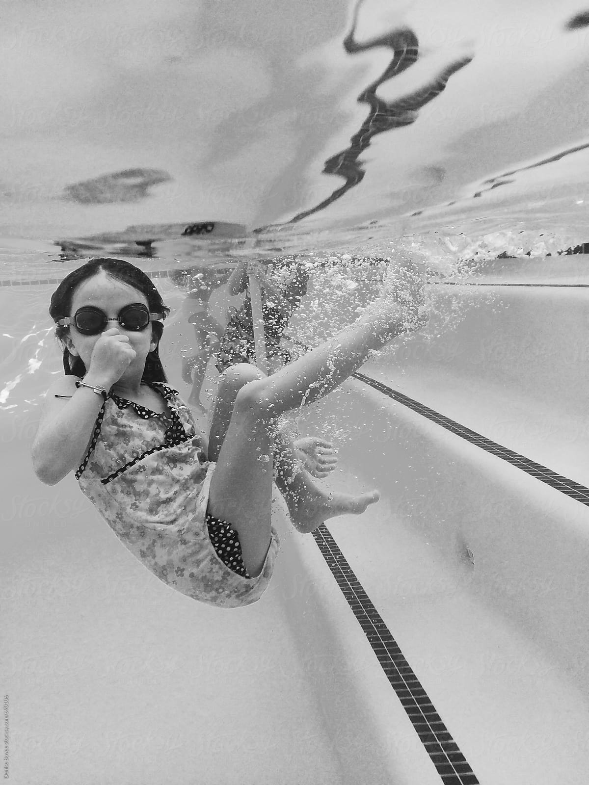 Young Girl Underwater In Pool Del Colaborador De Stocksy Denise