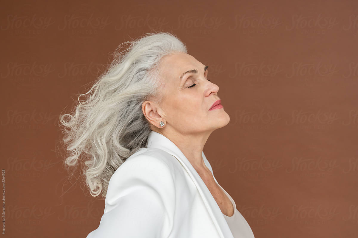 Silver Hair Woman With Closed Eyes Studio Portrait