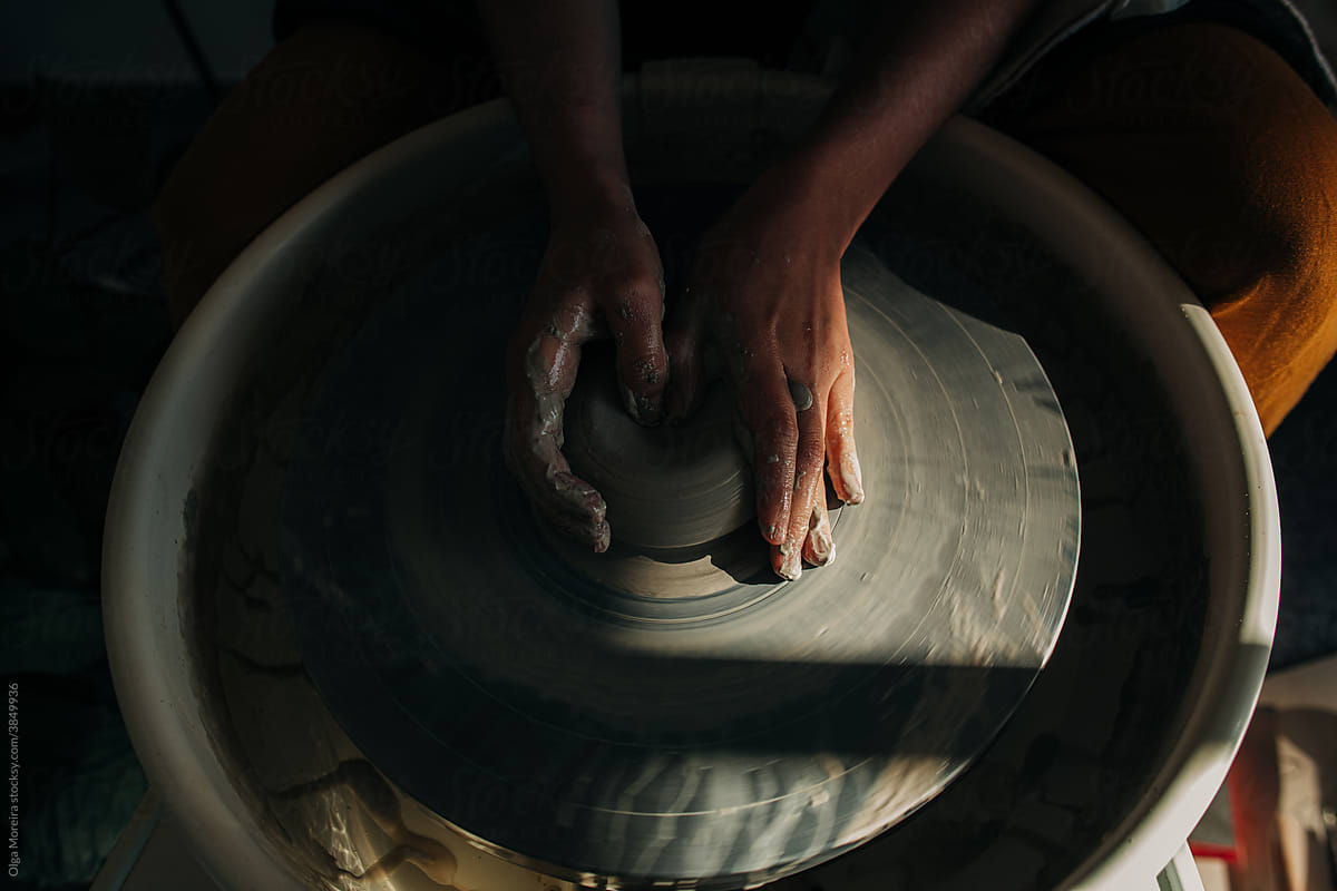 Female hands on a pottery wheel