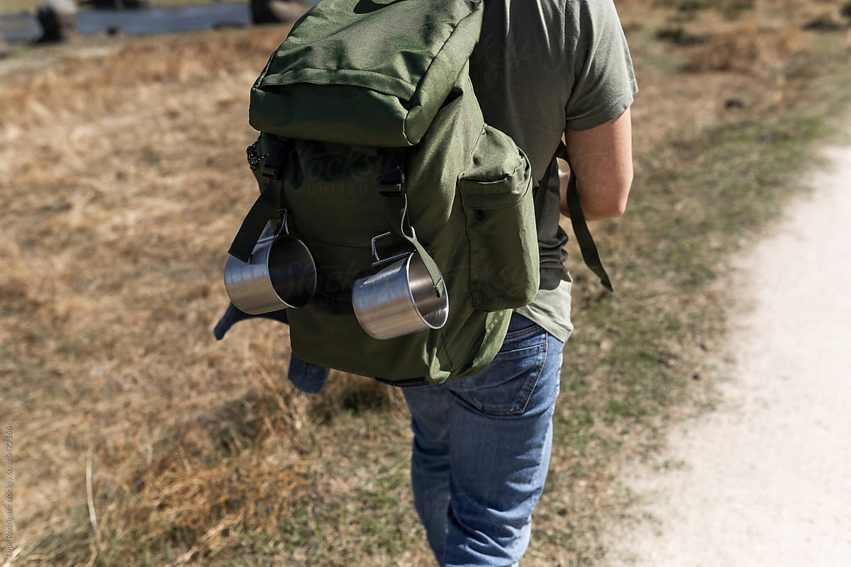 man with backpack exploring nature