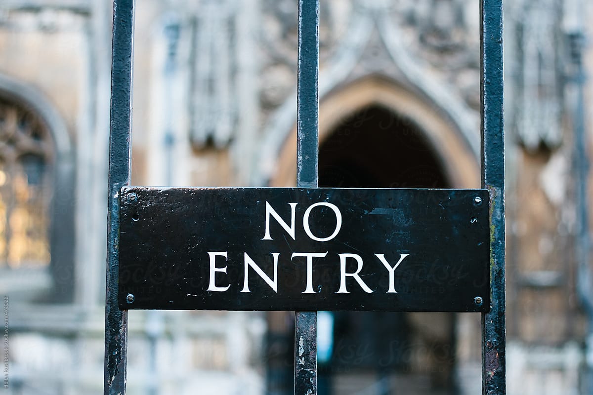 A no entry sign in front of a church